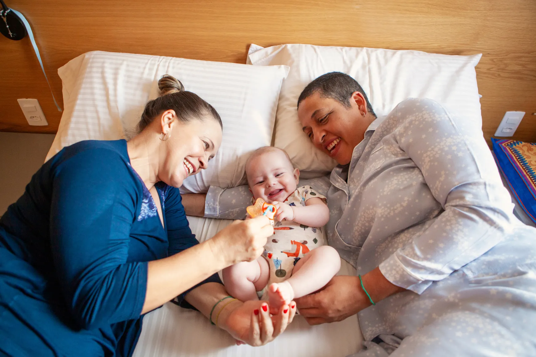 Moms with baby in bed